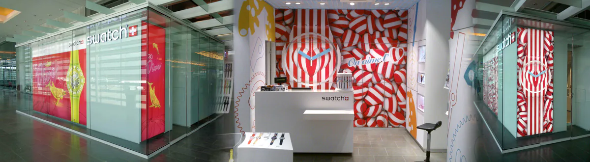 Publicité adhésive et toiles tendues posées en sous-traitance à l'aéroport de Toulouse Blagnac pour une marque de montres suisses. Confiez-nous vos poses